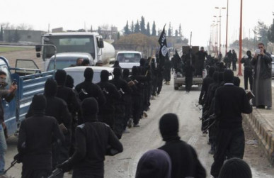 fighters of al qaeda linked islamic state of iraq and the levant parade at syrian town of tel abyad photo reuters