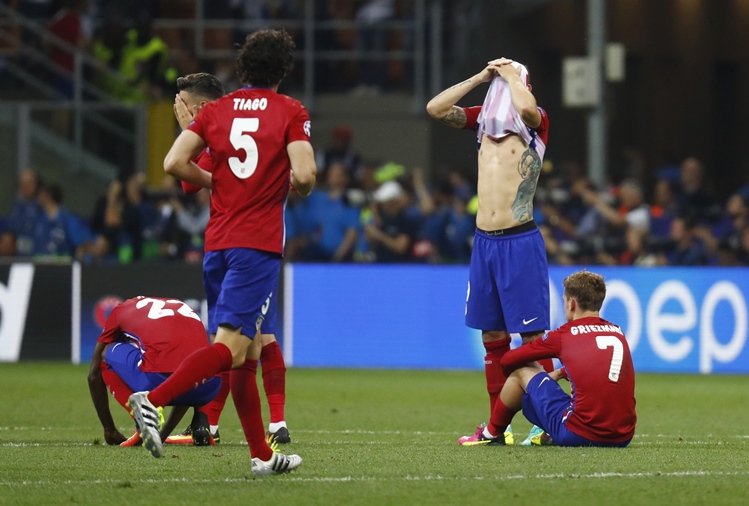 atletico madrid players look dejected after the penalty shootout against real madrid on may 28 photo reuters
