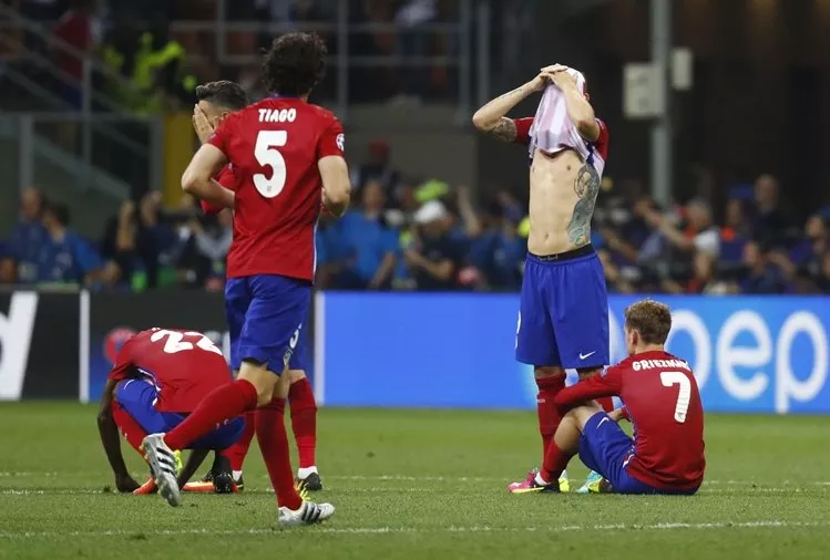 atletico madrid players look dejected after the penalty shootout against real madrid on may 28 photo reuters atletico madrid players look dejected after the penalty shootout against real madrid on may 28 photo reuters