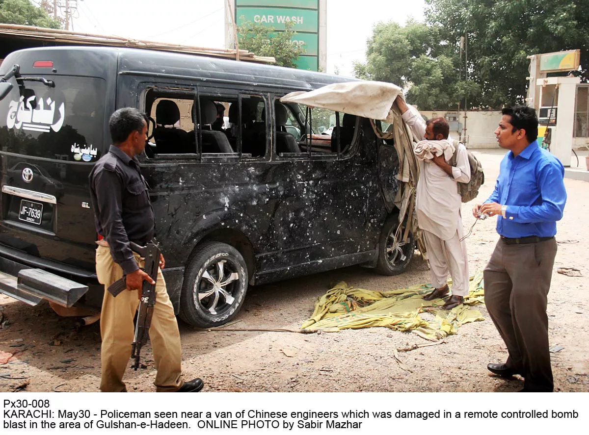 policemen inspect the car damaged in the incident on monday photo policemen inspect the car damaged in the incident on monday photo