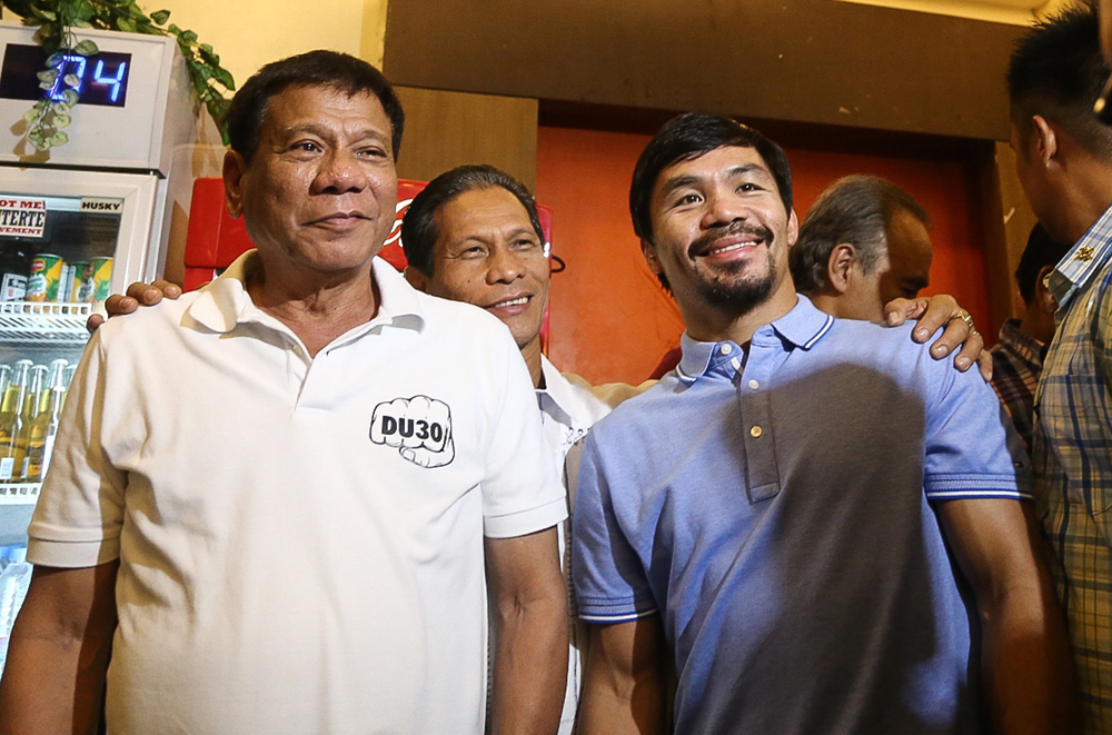 philippines 039 president elect rodrigo duterte l stands beside boxing icon and newly elected senator manny pacquiao r at a meeting in davao in southern island of mindanao on may 28 2017 afp photo