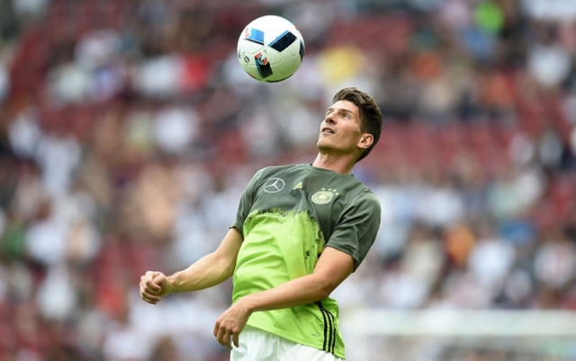mario gomez plays with the ball during the friendly match between germany and slovakia in augsburg germany on may 29 2016 photo afp