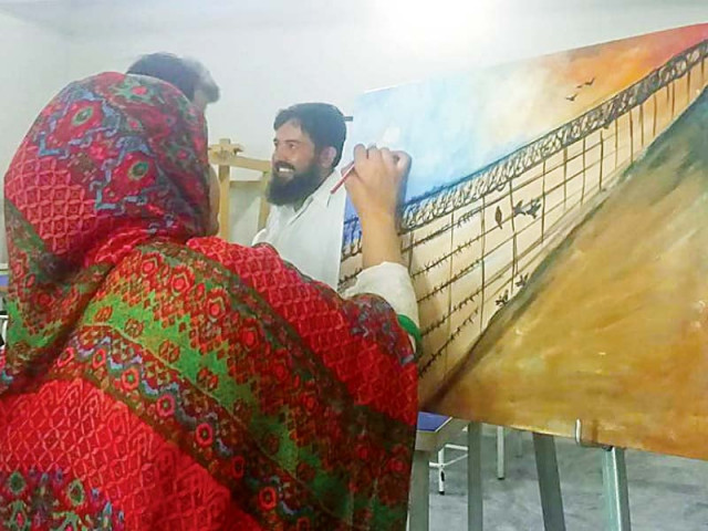 a woman paints suffering of illegal migrants photo express a woman paints suffering of illegal migrants photo express