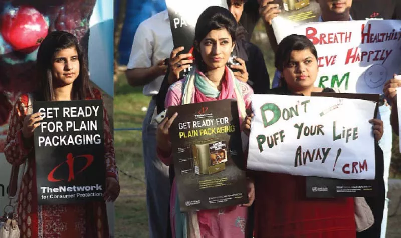 civil society activists holding placards inscribed with health warning signs stage a protest rally outside the national press club photo express civil society activists holding placards inscribed with health warning signs stage a protest rally outside the national press club photo express
