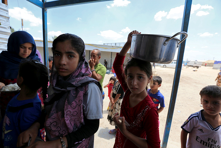 displaced iraqis who fled fighting between government forces and the islamic state is group in anbar province line up to collect donated food at the alexanzan camp in the dora neighbourhood on the southern outskirts of baghdad on may 31 2106 only a few hundred families have managed to slip out of anbar 039 s fallujah area ahead of the assault on the city with an estimated 50 000 civilians still trapped inside sparking fears the militants could try to use them as human shields photo afp