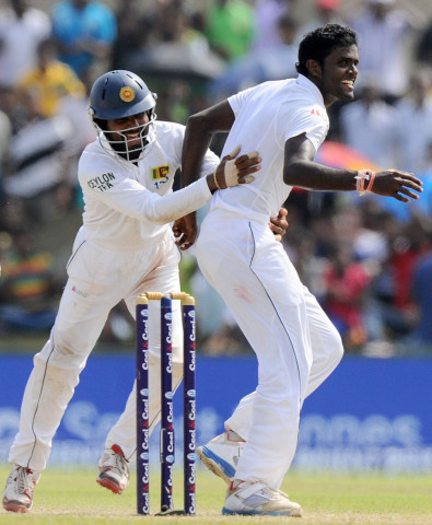 shaminda eranga r had abdur rehman caught behind for his 50th test scalp on august 10 2014 photo afp shaminda eranga r had abdur rehman caught behind for his 50th test scalp on august 10 2014 photo afp