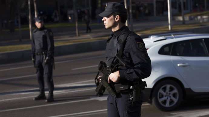 an armed spanish police officer stands guard during a security operation at colon square in central madrid january 13 2015 photo reuters