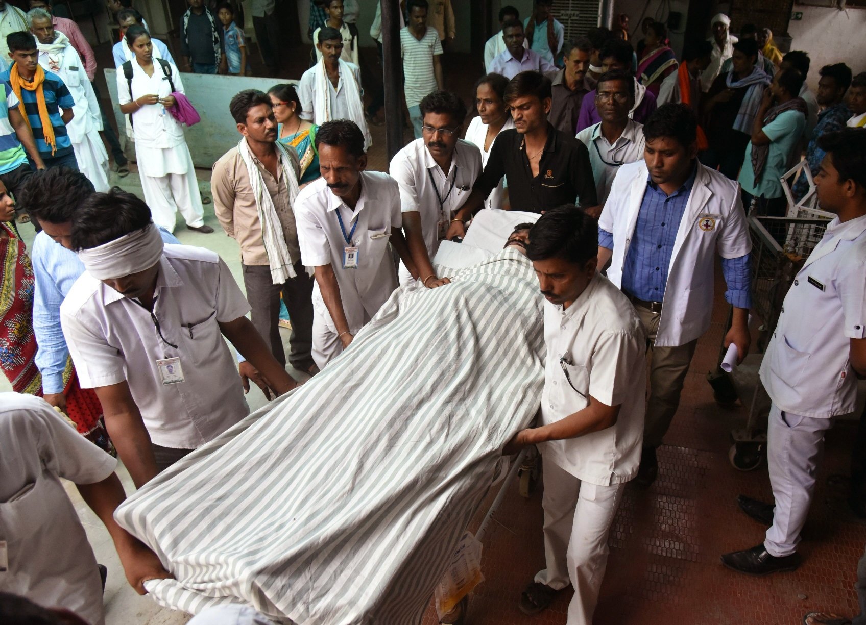 indian medical staff bring a man injured in a fire to hospital in wardha some 100kms from nagpur on may 31 2016 photo afp