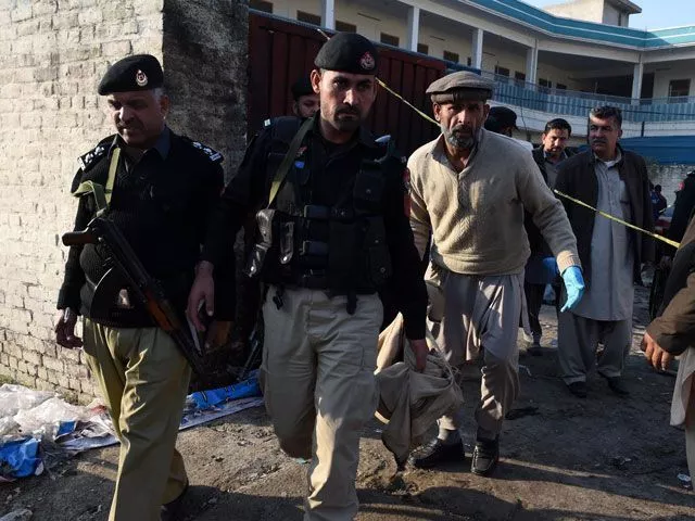 police personnel gather at the bomb blast site in mardan on december 29 2015 police personnel gather at the bomb blast site in mardan on december 29 2015