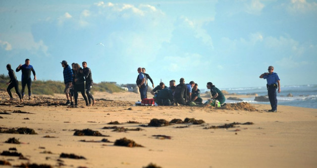 a photo taken on 31 may 2016 shows ambulance and police officers helping a critically injured surfer after a shark ripped off his leg in an attack in australia 039 s west with witnesses recounting how quot all hell broke loose quot as his board was snapped in half the attack happened at falcon beach a suburb south of perth not long after surf life saving wa a volunteer non profit organisation tweeted that a shark believed to be a great white had been sighted in the area afp photo a photo taken on 31 may 2016 shows ambulance and police officers helping a critically injured surfer after a shark ripped off his leg in an attack in australia 039 s west with witnesses recounting how quot all hell broke loose quot as his board was snapped in half the attack happened at falcon beach a suburb south of perth not long after surf life saving wa a volunteer non profit organisation tweeted that a shark believed to be a great white had been sighted in the area afp photo