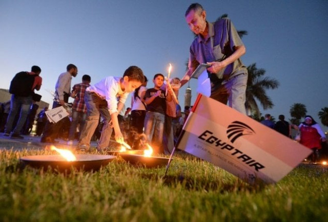 people light candles during a vigil in cairo on may 26 2016 for the victims of the egyptair flight that crashed in the mediterranean photo afp people light candles during a vigil in cairo on may 26 2016 for the victims of the egyptair flight that crashed in the mediterranean photo afp