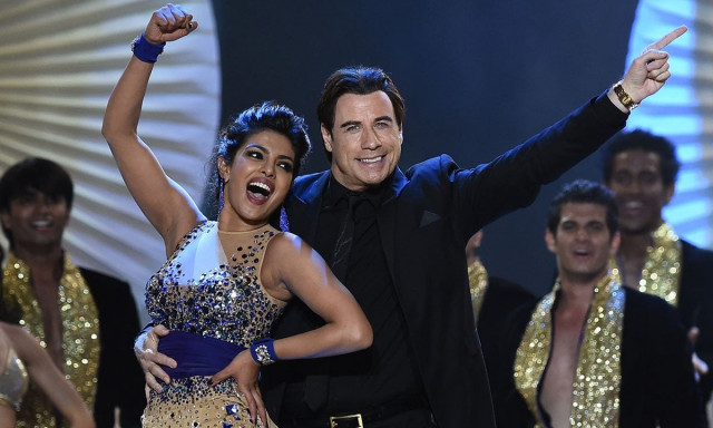 bollywood actress priyanka chopra and us actor john travota dance on stage at the raymond james stadium on the fourth and final day of the 15th international indian film academy iifa awards in tampa florida april 26 2014 photo afp bollywood actress priyanka chopra and us actor john travota dance on stage at the raymond james stadium on the fourth and final day of the 15th international indian film academy iifa awards in tampa florida april 26 2014 photo afp
