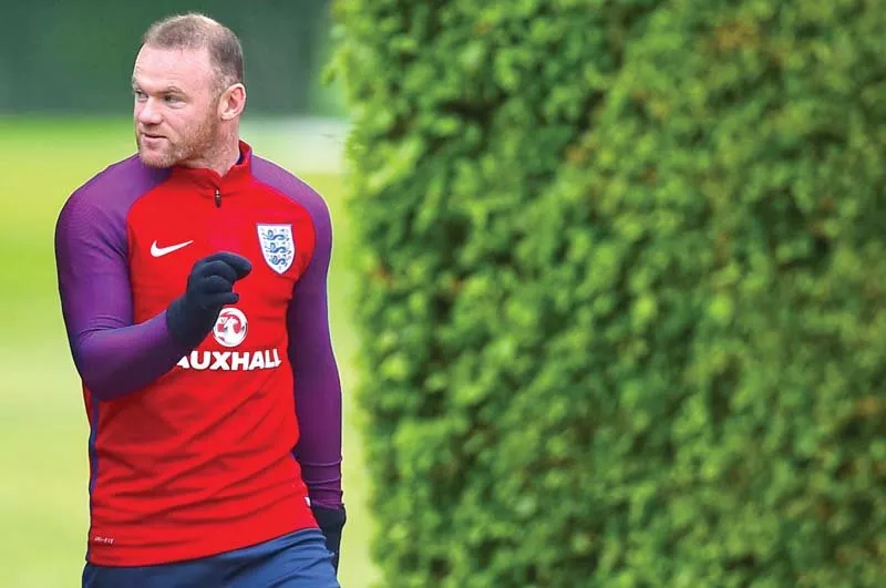 england skipper rooney attends a team training session in watford north of london before his team s friendly with portugal photo afp england skipper rooney attends a team training session in watford north of london before his team s friendly with portugal photo afp