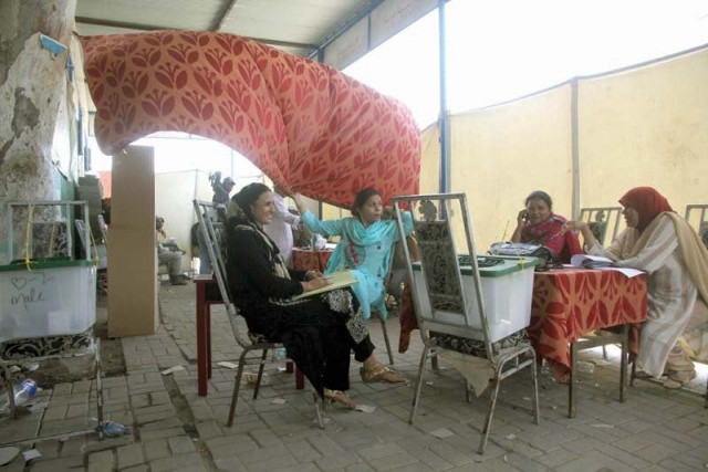 this polling station in martin quarters was relocated to a footpath at the eleventh hour where presiding officers worked without electricity and a flimsy curtain acting as a partition between men s and women s section photo athar khan express this polling station in martin quarters was relocated to a footpath at the eleventh hour where presiding officers worked without electricity and a flimsy curtain acting as a partition between men s and women s section photo athar khan express