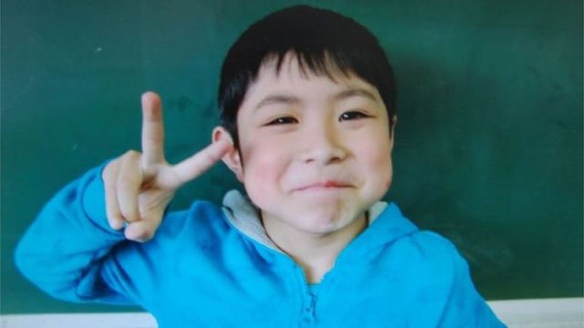 a seven year old boy missing since being abandoned in a bear inhabited forest in northern japan as a punishment nearly a week ago was found alive on friday and reunited with his parents officials said photo afp