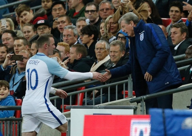 wayne rooney l shakes hands with roy hodgson after being substituted at wembley stadium in london on june 2 2016 photo afp wayne rooney l shakes hands with roy hodgson after being substituted at wembley stadium in london on june 2 2016 photo afp
