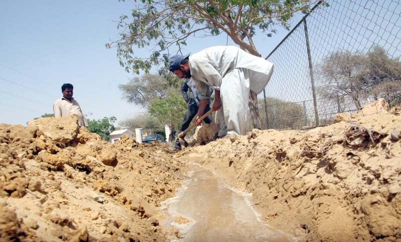 karachi zoo is home to over 900 animals all of whom are at risk due to the heatwave that claimed the lives of thousands of animals and humans last year bottom workers dig the canal laid down to supply water to cages photos athar khan express