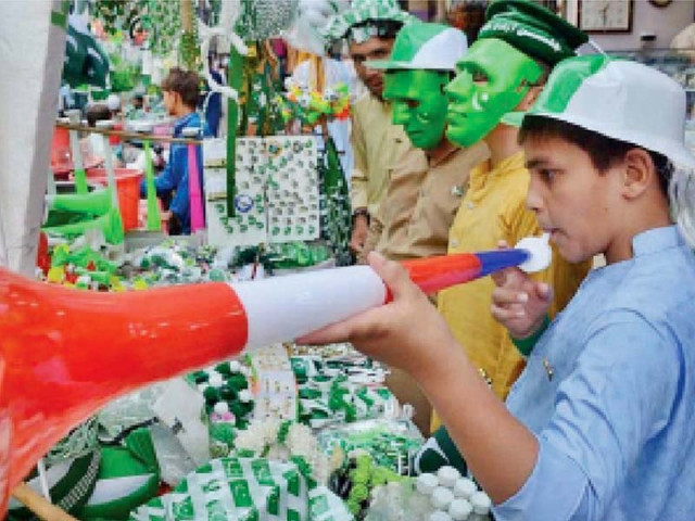 youngsters can be seen purchasing patriotic merchandise as they celebrate the 73rd independence day in peshwar with zeal and fervour photo app
