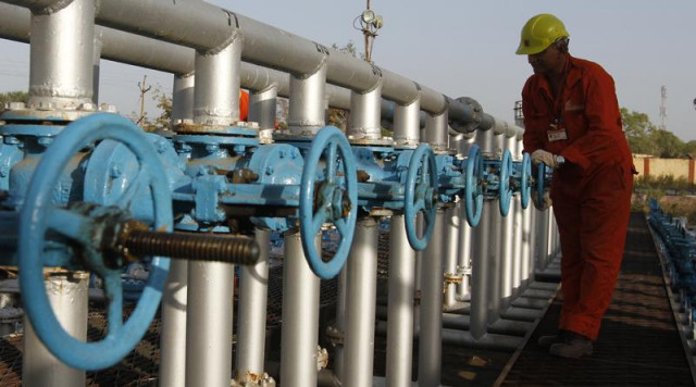 amount kept lower against outgoing year s initial target due to sharp fall in crude prices photo reuters amount kept lower against outgoing year s initial target due to sharp fall in crude prices photo reuters