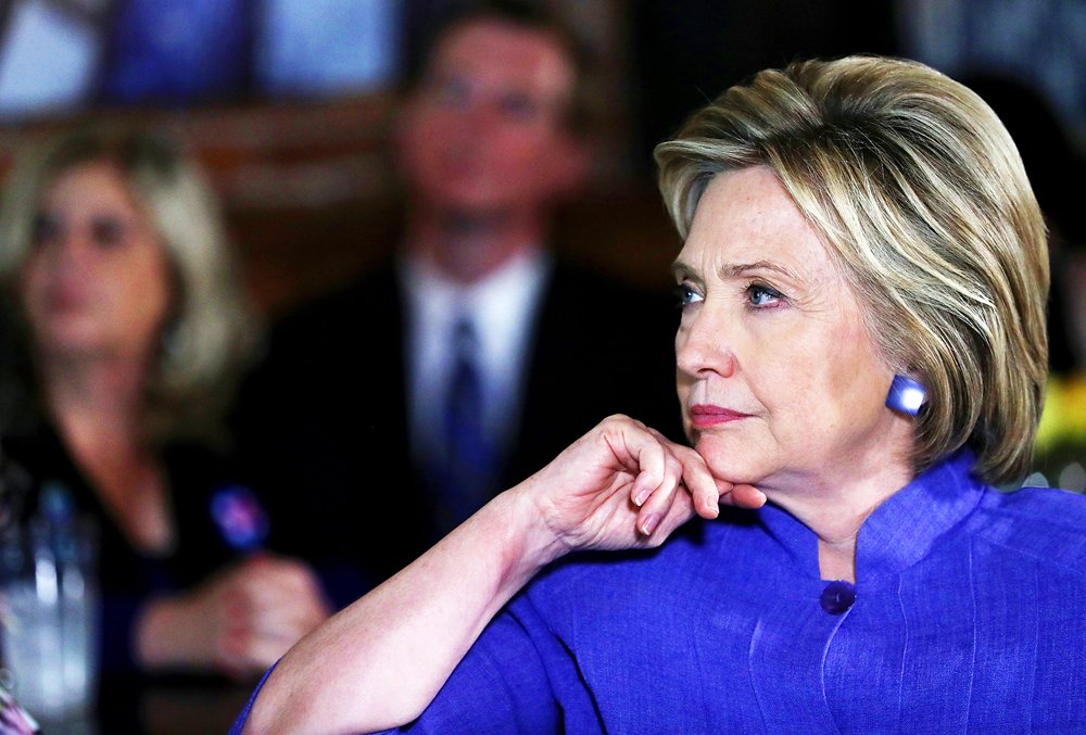 democratic presidential candidate former secretary of state hillary clinton looks on while participating in a discussion with community leaders on june 3 2016 in santa ana california with less than one week to go before the california presidential primary hillary clinton is campaigning in southern california photo afp