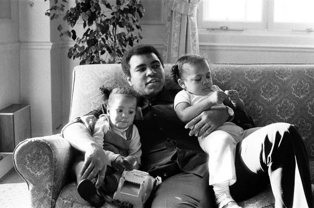 muhammad ali is seen cuddling his daughters laila l and hana r at a hotel in london britain december 19 1978 mandatory photo action images msi file