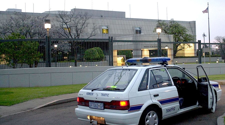 a south african police car is parked 11 september 2001 in front of the united states embassy in pretoria photo afp