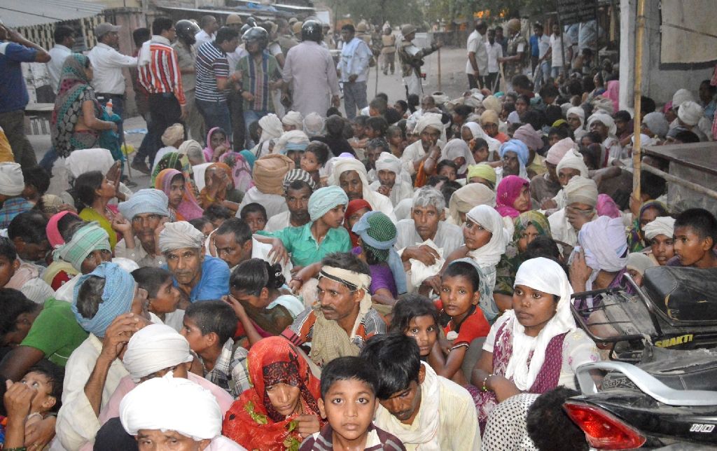 members of a sect said to have been living illegally after they were evicted from the jawahar bagh park in mathura on june 2 2016 photo afp