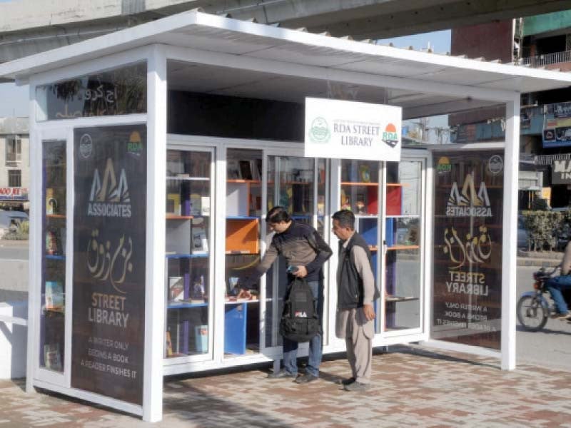 book lovers look over books in the first street library on murree road rawalpindi photo agha mahroz express