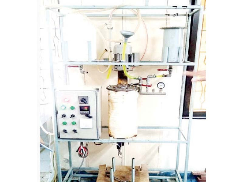 machinery developed by young pakistani engineers to make biodiesel from used cooking oil and the production cycle photo express