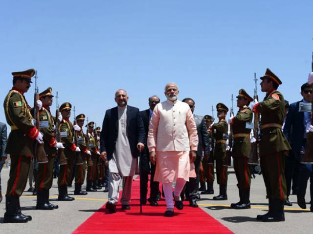 indian prime minister narendra modi c arrives ahead of the inauguration of the salma hydroelectric dam in herat on june 4 2016 photo afp