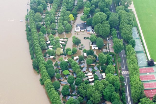 this aerial photo taken and handout on june 4 2016 by the french air force shows the paris indigo camping site flooded by the river seine after it burst its banks near the pont de suresnes bridge in paris the rain swollen river seine in paris began to recede on june 4 2016 after reaching its highest level in three decades photo afp