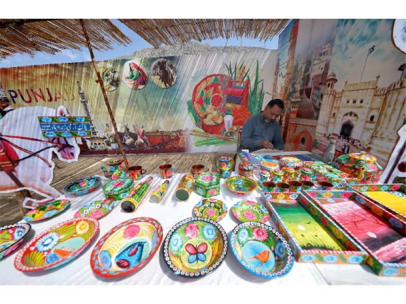 a local painter decorates utensils with truck arts in orakzai festival photo express