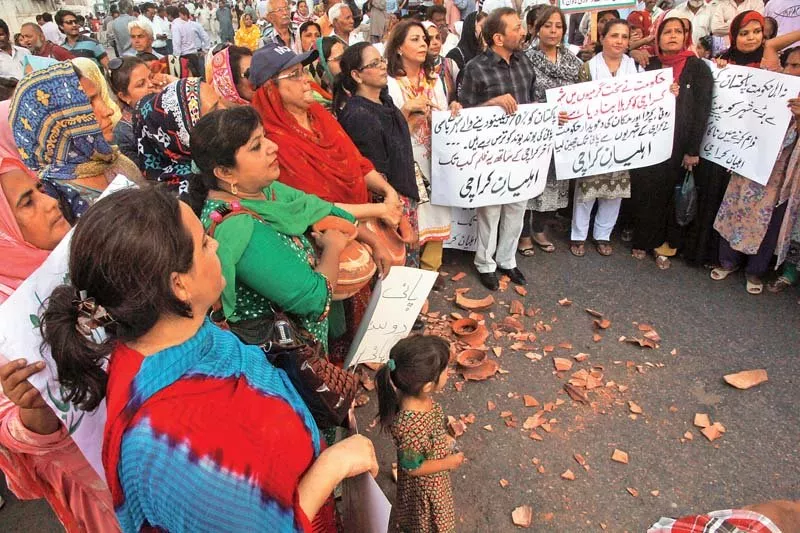 the protest staged by mqm continued late into the evening with workers including women smashing clay pots onto the road as a sign of protest photo athar khan express the protest staged by mqm continued late into the evening with workers including women smashing clay pots onto the road as a sign of protest photo athar khan express