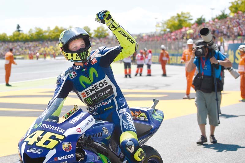 rossi celebrates after winning the catalan grand prix to boost his prospects of a record equalling eighth motogp world championship photo afp