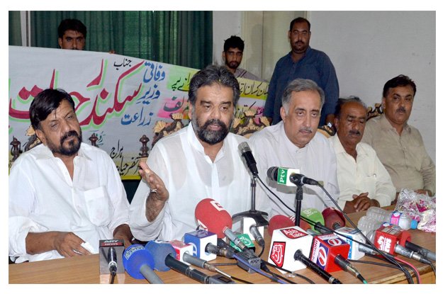 minister for national food security and research sikandar hayat bosan addressing a press conference at multan press club photo express