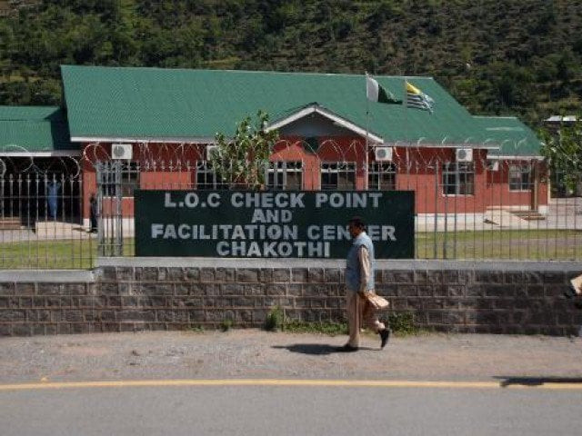 pakistani kashmiri men walk past the truck supply check point to india at the line of control loc in chakothi on september 18 2013 photo afp pakistani kashmiri men walk past the truck supply check point to india at the line of control loc in chakothi on september 18 2013 photo afp