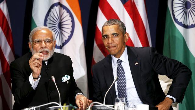 us president barack obama and prime minister narendra modi clasp hands while meeting at the climate change summit in paris photo reuters