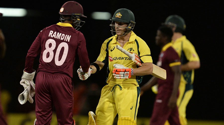 david warner shakes hands with denesh ramdin after australia 039 s win photo afp