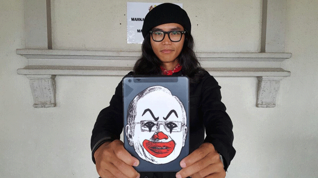 fahmi reza 039 s depictions of najib went viral earlier this year and posters and stickers bearing the images have also appeared in public places earning the designer activist comparisons to street art provocateurs like banksy photo twitter