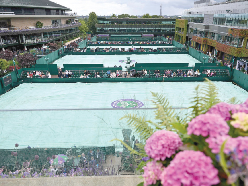 rain covers are pictured on courts 14 15 16 on the fifth day of the 2024 wimbledon championships at the all england lawn tennis and croquet club photo afp