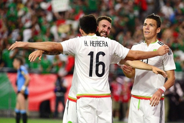 hector herrera is congratulated by miguel layun after scoring a goal in extra time against uruguay during the 2016 copa america centenario group c match at university of phoenix stadium on june 5 2016 in glendale arizona photo afp hector herrera is congratulated by miguel layun after scoring a goal in extra time against uruguay during the 2016 copa america centenario group c match at university of phoenix stadium on june 5 2016 in glendale arizona photo afp