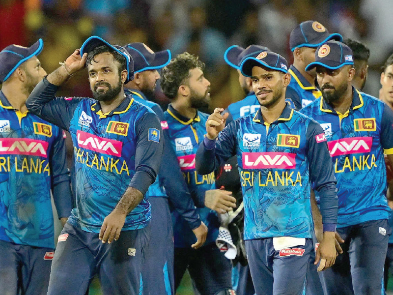 sri lankan team celebrates after the superb tied match with india photo afp