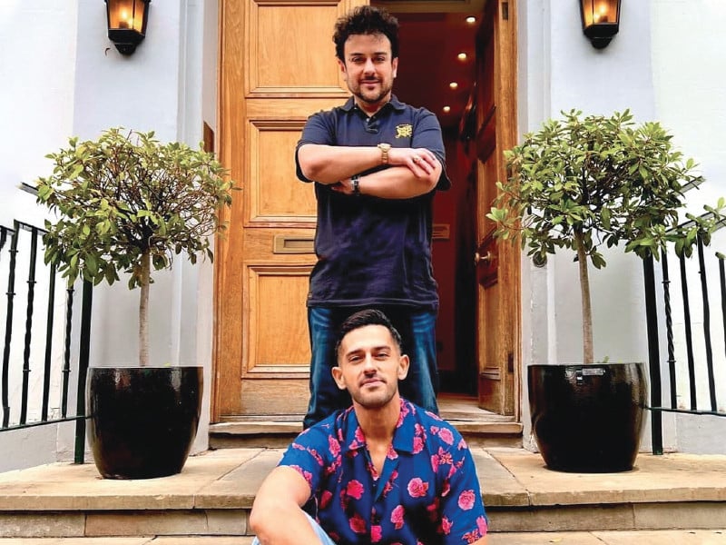 azaan is seen sitting on the steps of the famous london abbey road studios with his father standing above him wide smiles on both their faces photo file