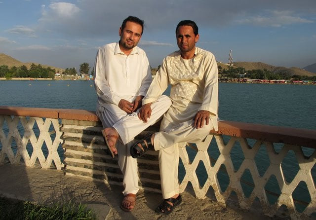 this photograph taken on july 10 2014 shows national public radio npr interpreter zabihullah tamanna l as he poses with a friend at the qargha lake on the outskirts of kabul photo afp this photograph taken on july 10 2014 shows national public radio npr interpreter zabihullah tamanna l as he poses with a friend at the qargha lake on the outskirts of kabul photo afp