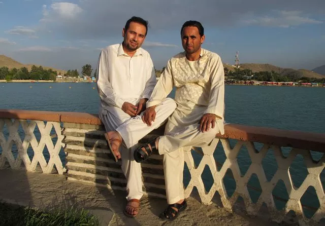 this photograph taken on july 10 2014 shows national public radio npr interpreter zabihullah tamanna l as he poses with a friend at the qargha lake on the outskirts of kabul photo afp this photograph taken on july 10 2014 shows national public radio npr interpreter zabihullah tamanna l as he poses with a friend at the qargha lake on the outskirts of kabul photo afp