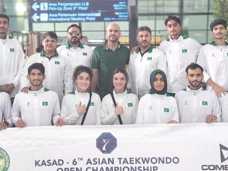 pak 16 member taekwondo squad pose for cameras in indonesia where it will compete in 6th asian open kyorugi taekwondo photo app