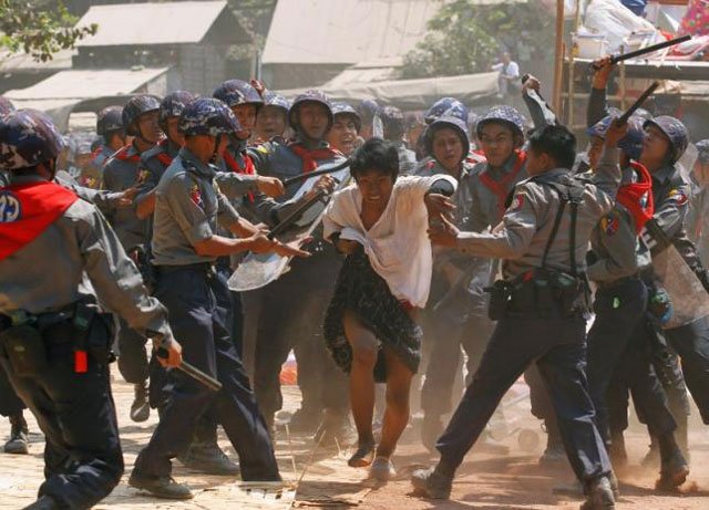 police hit a student protester during violence in letpadan march 10 2015 photo reuters