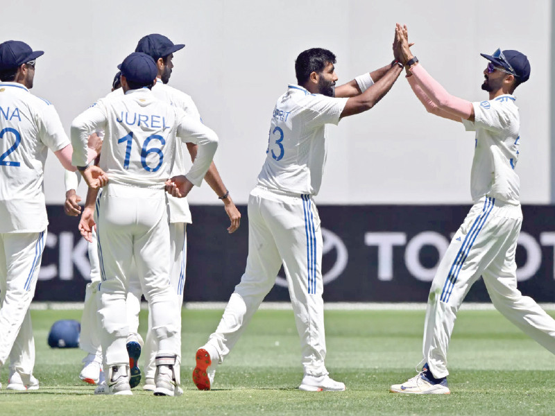 indian players celebrate the dismissal of travis head for 89 in the first test at perth photo afp