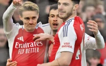 odegaard leads arsenal to top spot