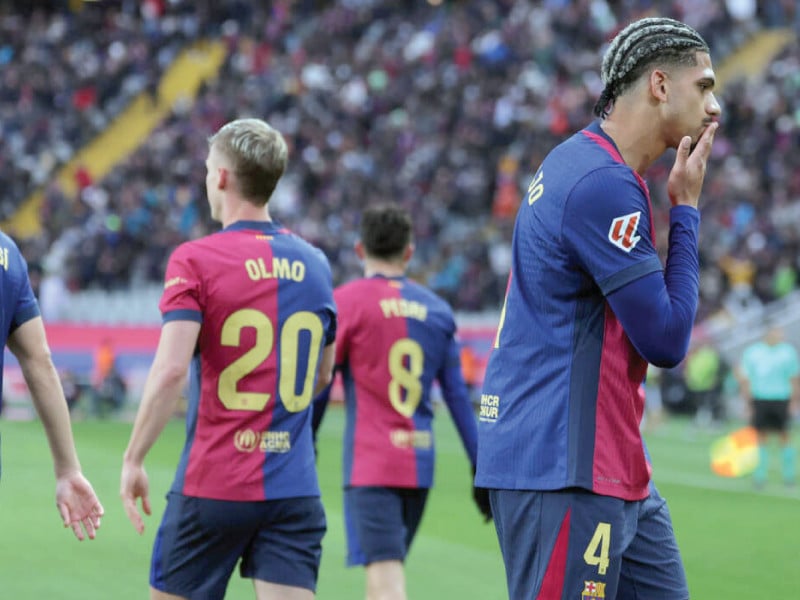 barcelona s uruguayan defender ronald araujo celebrates scoring his team s third goal against real sociedad photo afp